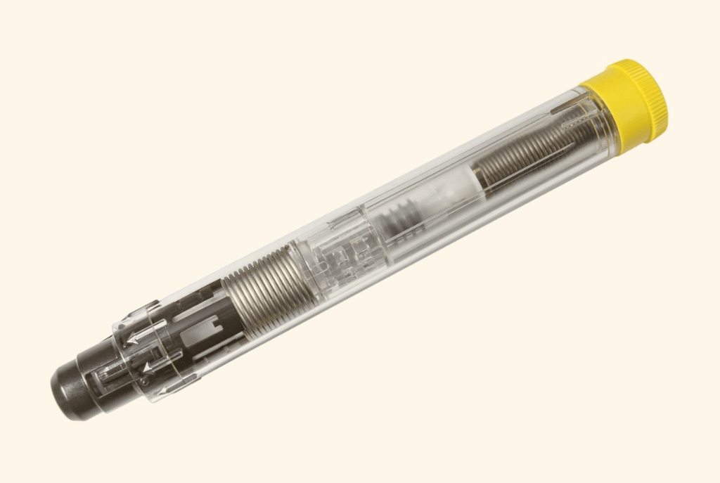 Close-up of a medical device used in drug delivery, representing the intersection of pharmaceutical science and engineering design