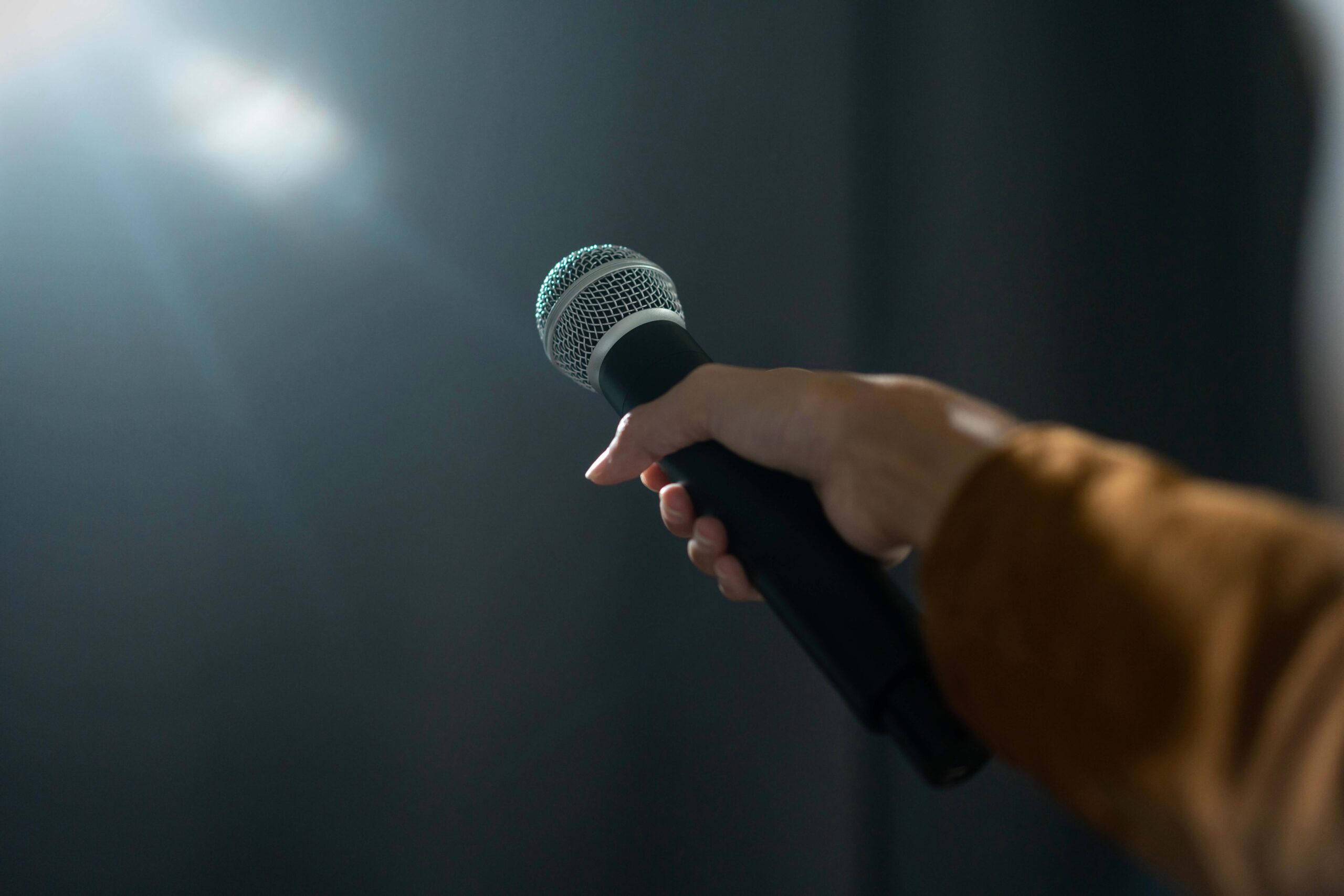 Close-up of a microphone symbolizing storytelling in public speaking and authentic audience connection
