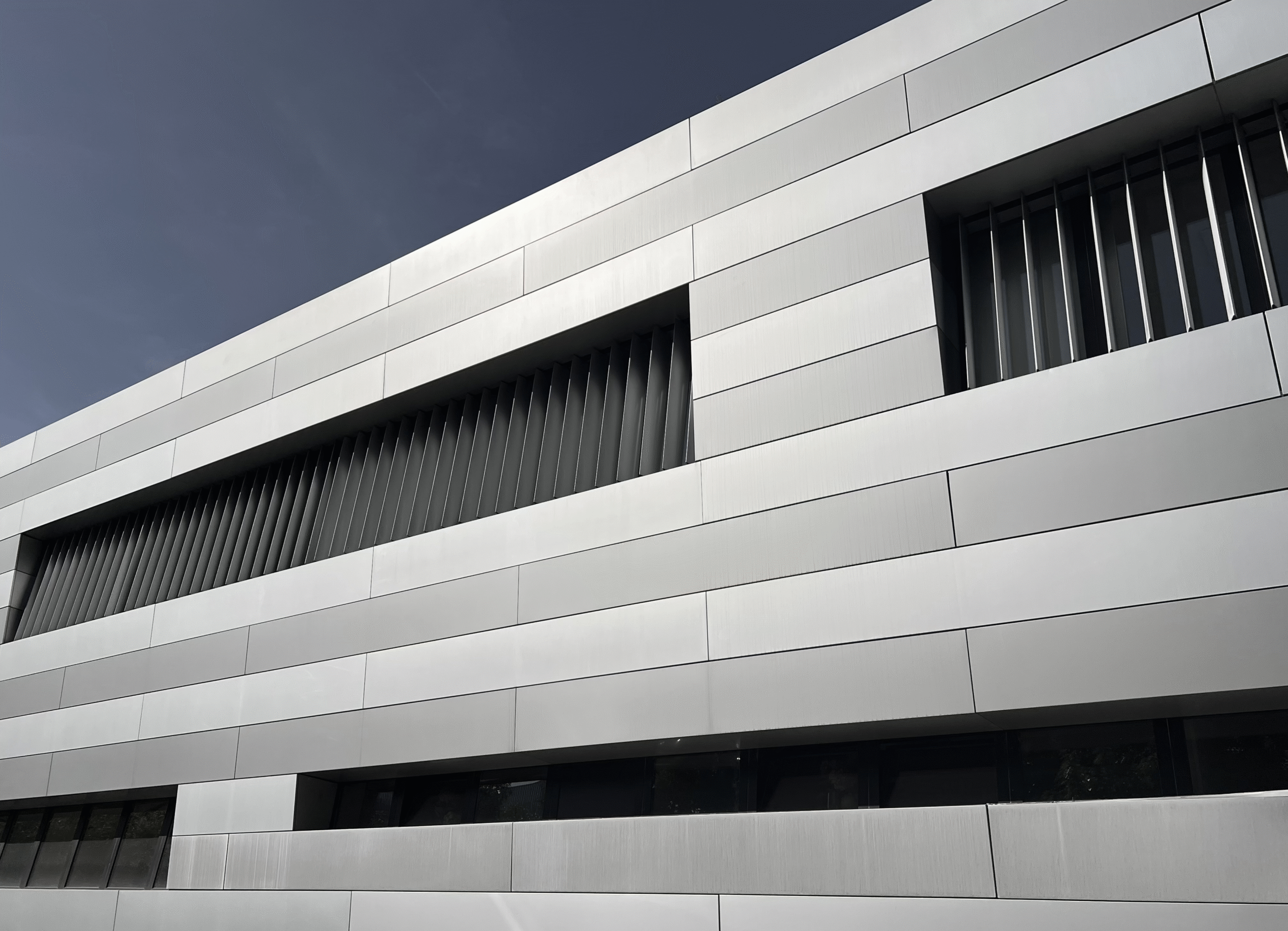 Modern minimalist building facade, symbolizing structure in biotech trial design and drug delivery case study