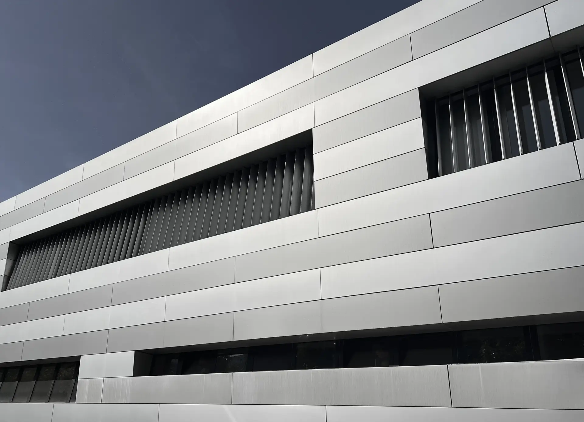 Modern minimalist building facade, symbolizing structure in biotech trial design and drug delivery case study